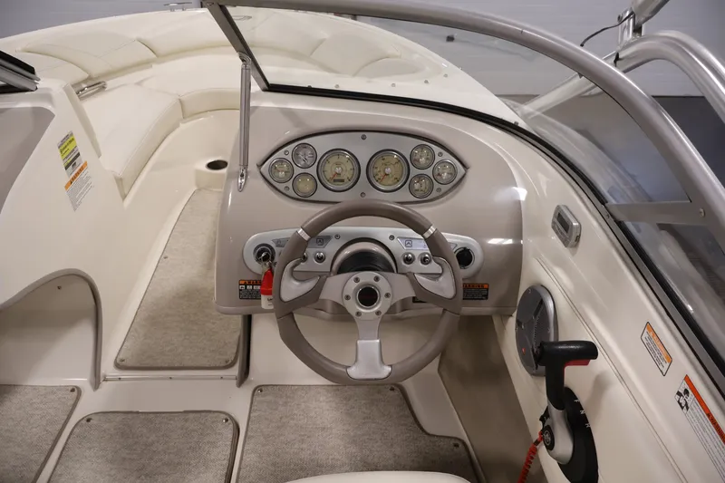 Slide: The Image of 2008 Maxum 1900 SR3 boat interior with steering wheel and dashboard controls. - 17