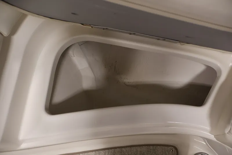 Slide: The Image of Storage compartment in a 2008 Maxum 1900 SR3 boat interior. - 13