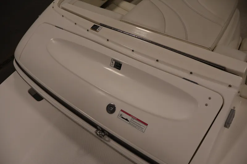 Slide: The Image of 2008 Maxum 1900 SR3 boat interior with white seating and storage compartment. - 34