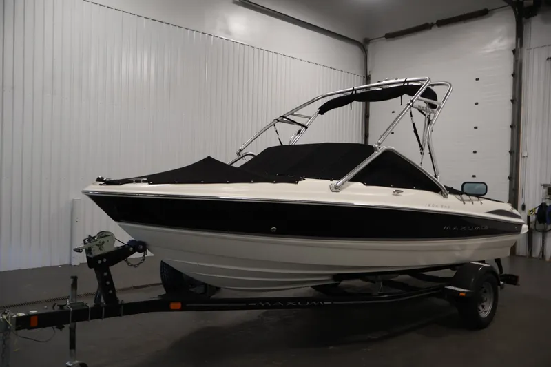 Slide: The Image of 2008 Maxum 1900 SR3 boat on trailer in indoor storage facility. - 43