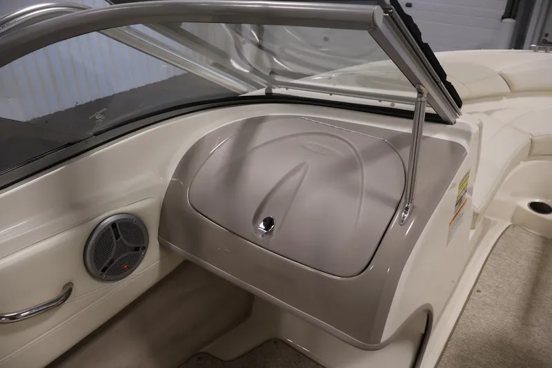 Slide: The Image of 2008 Maxum 1900 SR3 boat interior with speaker and glove compartment. - 24