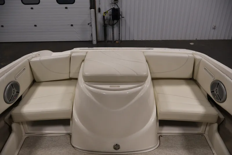 Slide: The Image of 2008 Maxum 1900 SR3 boat interior with beige seating and built-in speakers. - 31