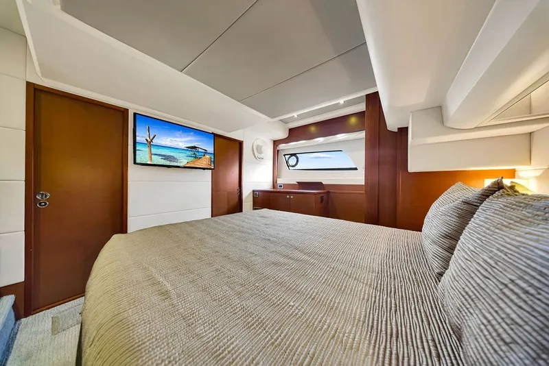 Slide: The Image of Luxurious bedroom interior of 2013 Prestige 550 yacht with modern decor and scenic window view. - 64