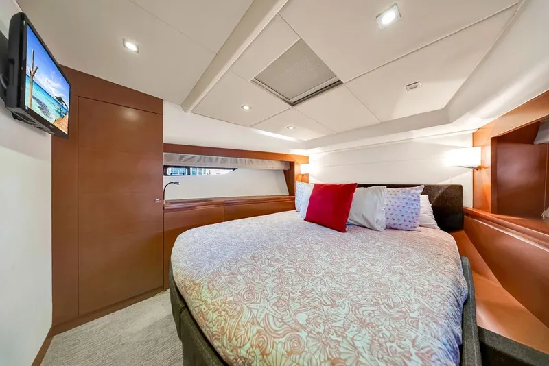 Slide: The Image of Luxurious cabin interior of 2013 Prestige 550 yacht with cozy bed and modern decor. - 77