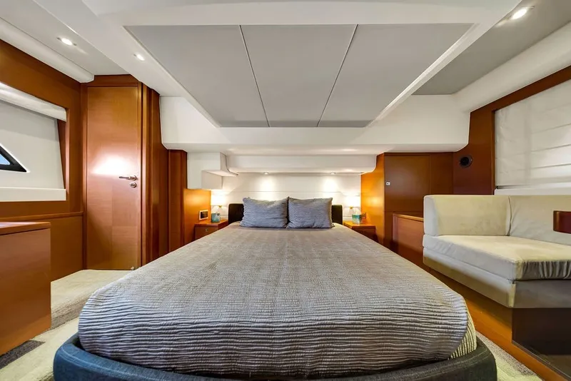 Slide: The Image of Luxurious bedroom interior of 2013 Prestige 550 yacht with modern design and cozy ambiance. - 59