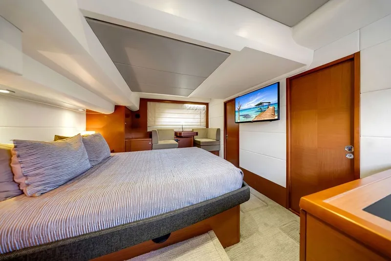 Slide: The Image of Luxurious bedroom interior of 2013 Prestige 550 yacht with modern decor and flat-screen TV. - 57