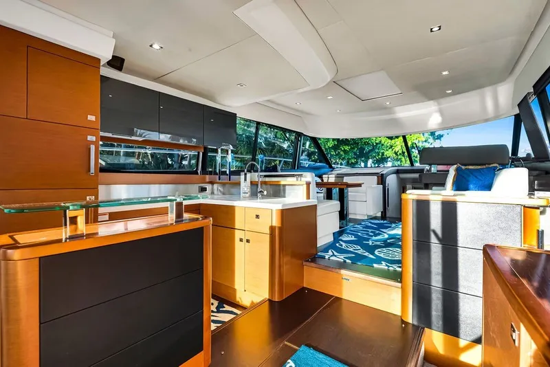 Slide: The Image of Luxurious interior of a 2013 Prestige 550 yacht with modern furnishings and panoramic windows. - 44