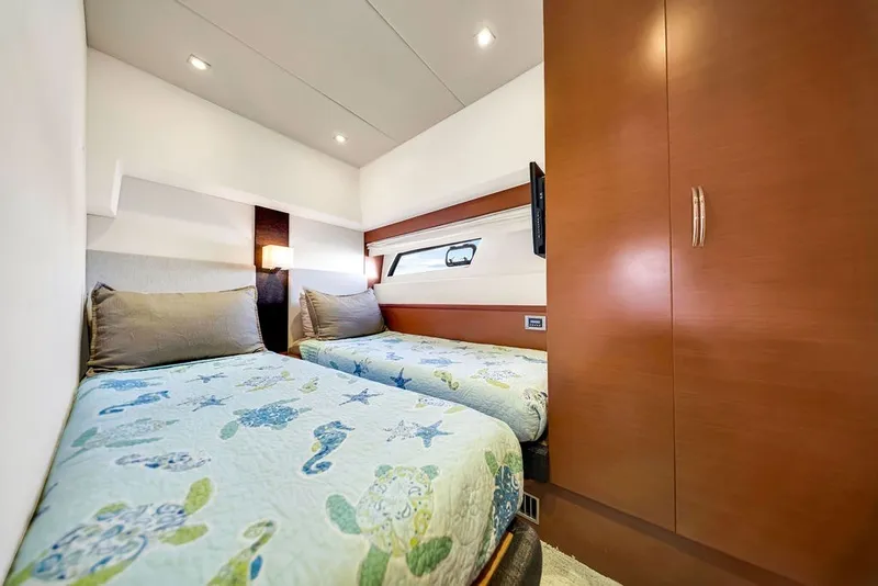 Slide: The Image of Luxurious twin cabin in 2013 Prestige 550 yacht with modern decor and ample lighting. - 73
