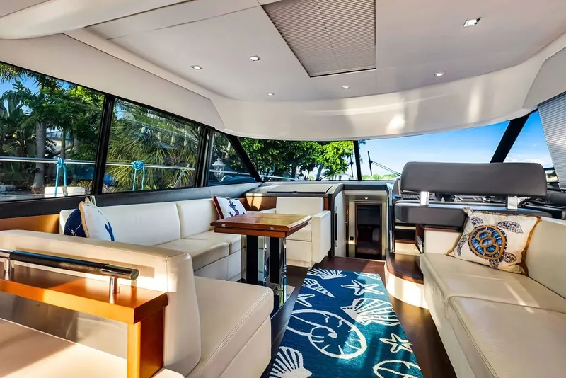Slide: The Image of Luxurious interior of 2013 Prestige 550 yacht with elegant seating and nautical decor. - 48
