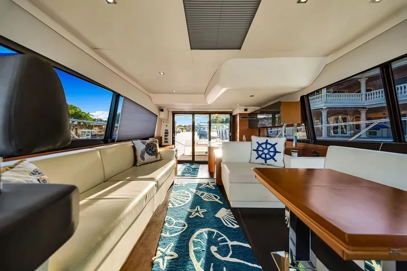 Slide: The Image of Luxurious interior of a 2013 Prestige 550 yacht with elegant seating and nautical decor. - 49