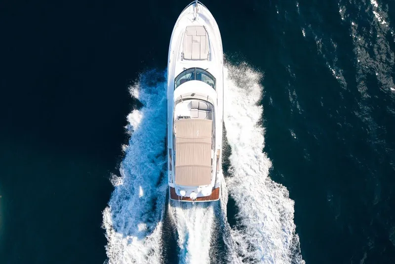Slide: The Image of Aerial view of 2013 Prestige 550 yacht cruising on open water. - 20