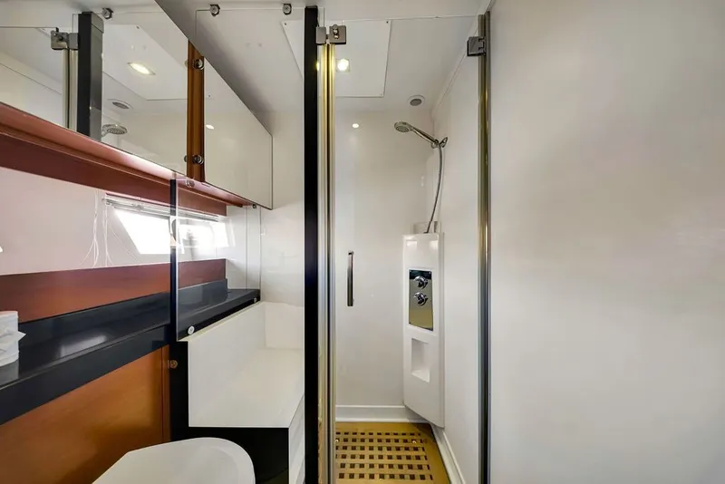 Slide: The Image of Luxurious bathroom interior of 2013 Prestige 550 yacht with modern shower and sleek cabinetry. - 81