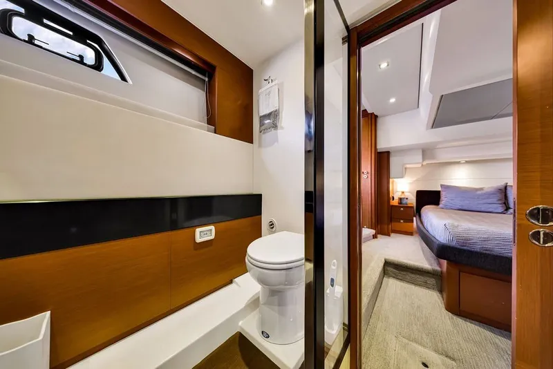 Slide: The Image of Luxurious 2013 Prestige 550 yacht interior featuring a modern bathroom and cozy bedroom. - 68