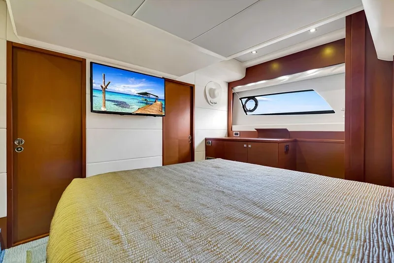 Slide: The Image of Luxurious 2013 Prestige 550 yacht bedroom with modern decor and ocean view. - 63