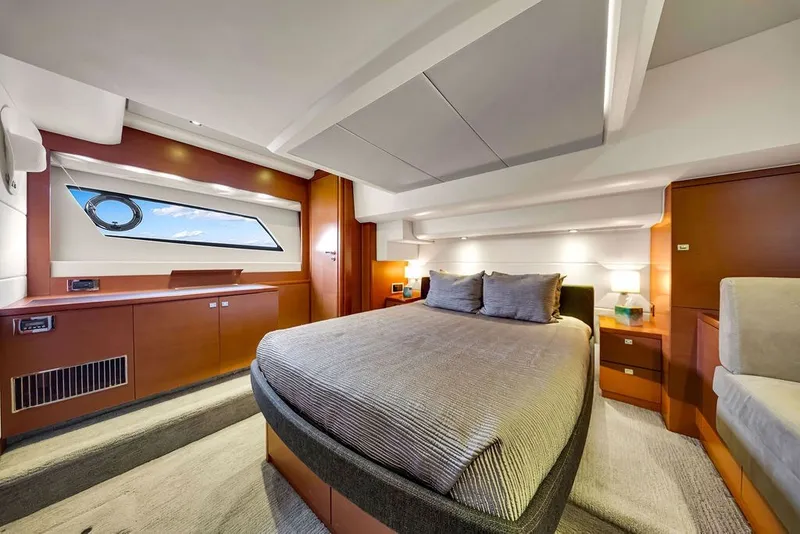 Slide: The Image of Luxurious bedroom interior of 2013 Prestige 550 yacht with modern design and elegant furnishings. - 61