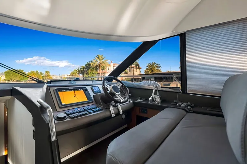 Slide: The Image of Interior view of 2013 Prestige 550 yacht cockpit with modern navigation equipment. - 51