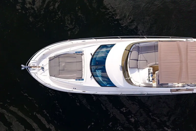 Slide: The Image of Aerial view of 2013 Prestige 550 yacht on dark water. - 29