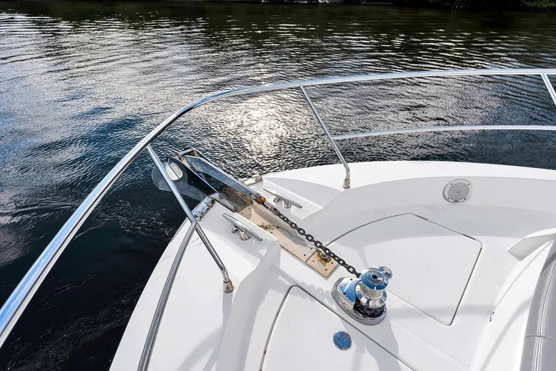 Slide: The Image of Bow of a 2013 Prestige 550 yacht with anchor chain and calm water. - 33