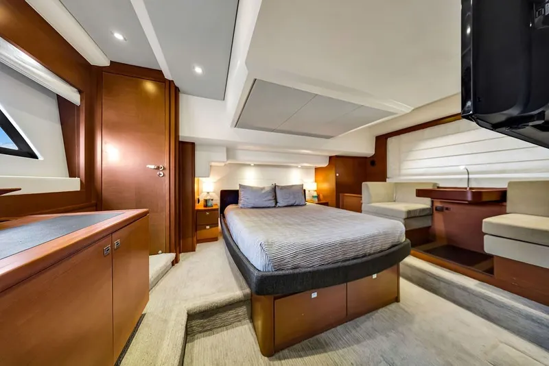 Slide: The Image of Luxurious interior of 2013 Prestige 550 yacht with elegant wood finishes and cozy seating. - 56