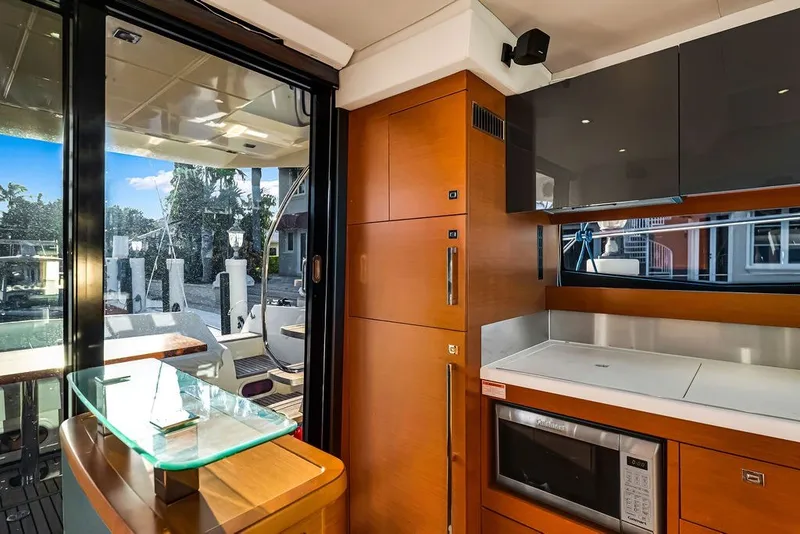 Slide: The Image of Luxurious interior of 2013 Prestige 550 yacht with modern kitchen amenities. - 46