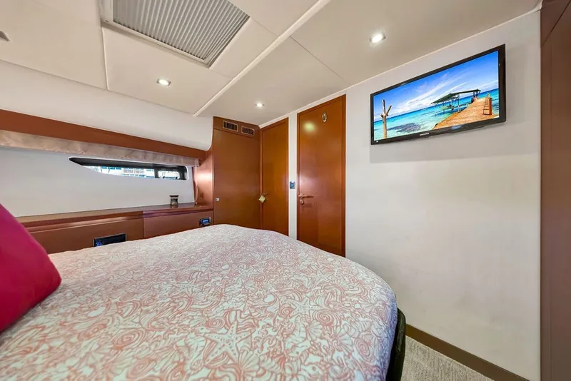 Slide: The Image of Luxurious cabin interior of 2013 Prestige 550 yacht with cozy bed and wall-mounted TV. - 76