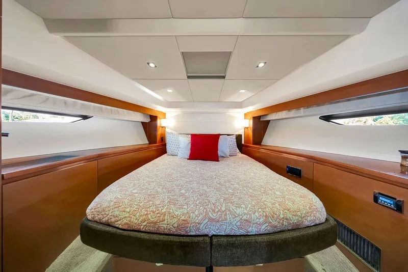 Slide: The Image of Luxurious cabin interior of 2013 Prestige 550 yacht with elegant bedding and ambient lighting. - 78
