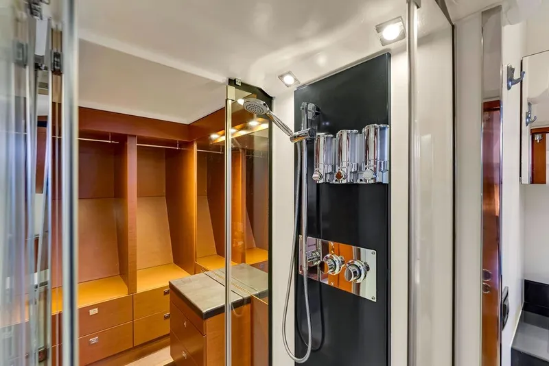 Slide: The Image of Luxurious shower area in 2013 Prestige 550 yacht with modern fixtures and wood accents. - 69