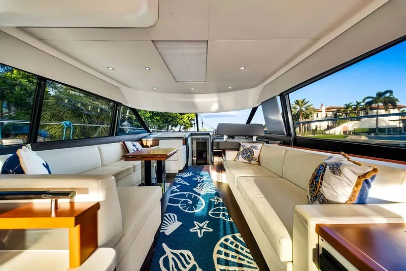 Slide: The Image of Luxurious interior of 2013 Prestige 550 yacht with elegant seating and nautical decor. - 47