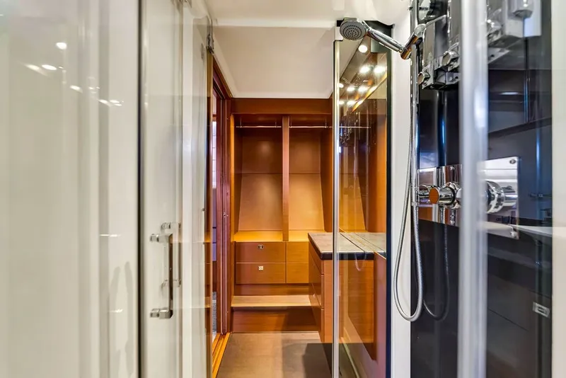 Slide: The Image of Luxurious bathroom interior on a 2013 Prestige 550 yacht, featuring modern shower and wooden cabinetry. - 70