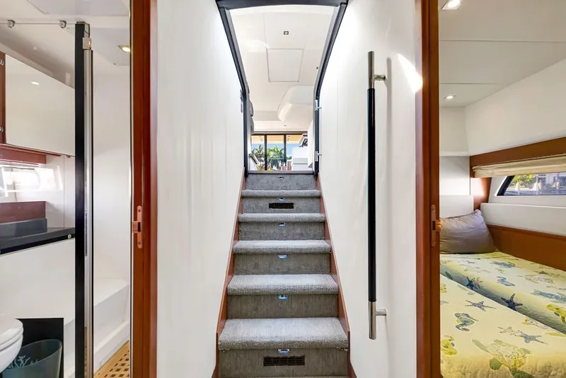 Slide: The Image of Interior of 2013 Prestige 550 yacht with stairs, bathroom, and bedroom. - 71