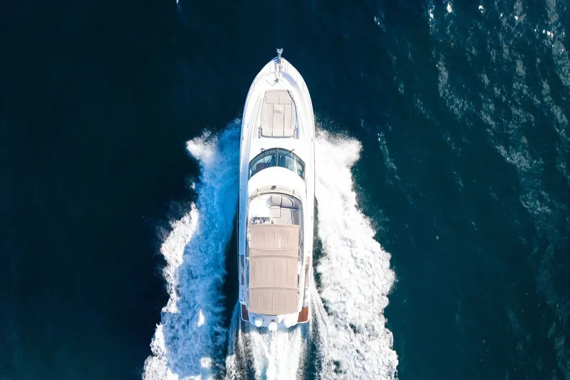 Slide: The Image of Aerial view of 2013 Prestige 550 yacht cruising on open water. - 21