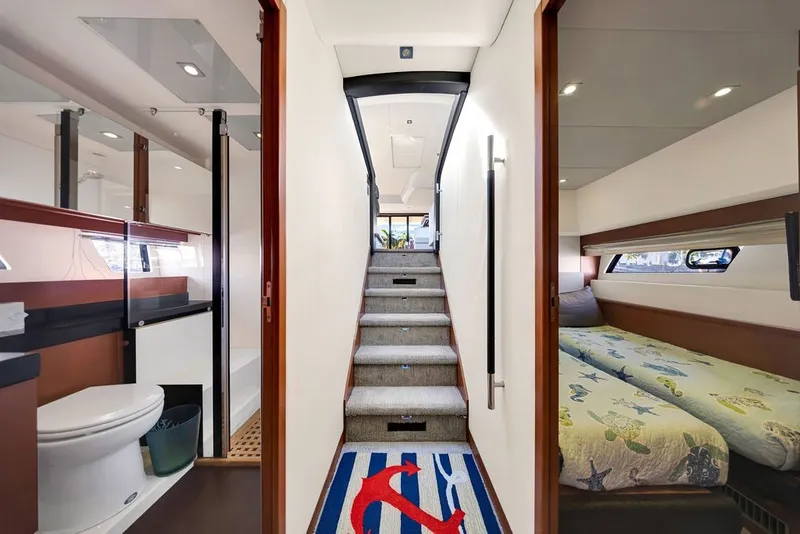 Slide: The Image of Interior of 2013 Prestige 550 yacht featuring a bathroom, staircase, and bedroom. - 72