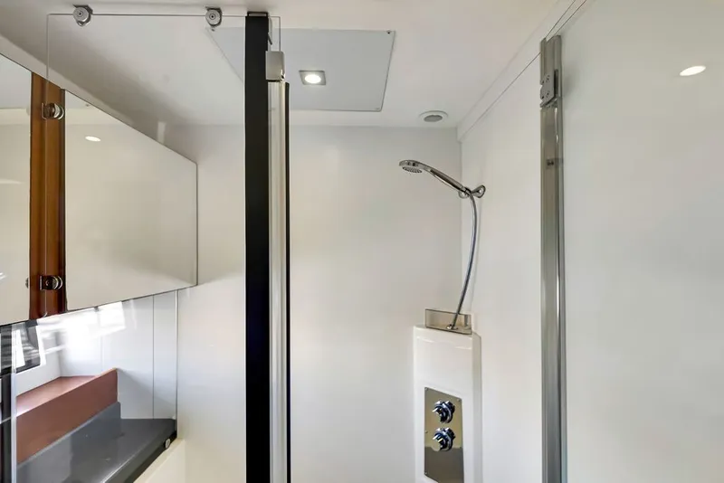 Slide: The Image of Modern shower area in 2013 Prestige 550 yacht, featuring sleek fixtures and glass enclosure. - 82