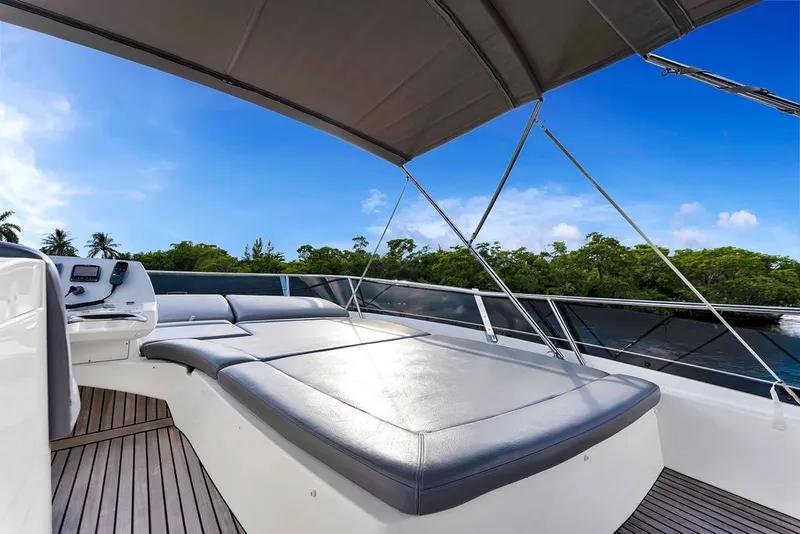 Slide: The Image of Luxurious 2013 Prestige 550 yacht deck with sunbed, under clear blue sky. - 41