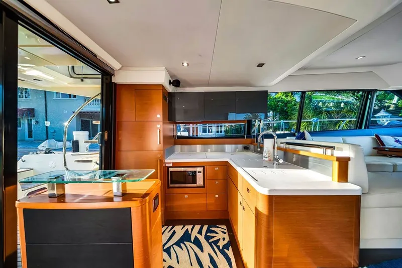 Slide: The Image of Luxurious interior of a 2013 Prestige 550 yacht with modern kitchen and seating area. - 45