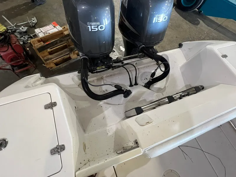 Slide: The Image of Two Yamaha 150 outboard engines are mounted on the stern of an Edgewater 245CC boat. - 5