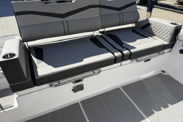 Slide: The Image of 2027 Monterey Elite 30 OB boat seating with modern design and cup holders. - 14