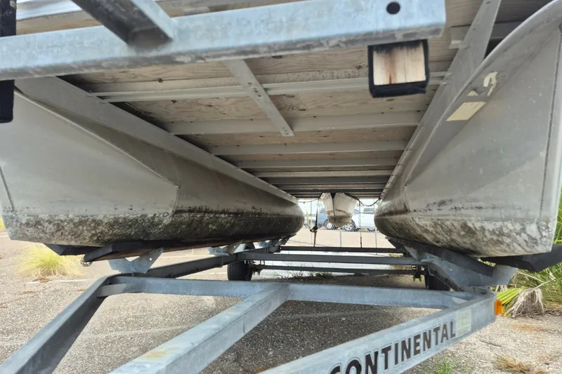 Slide: The Image of Underneath view of a 2021 Avalon VLS 2080 QL pontoon boat on a trailer. - 7
