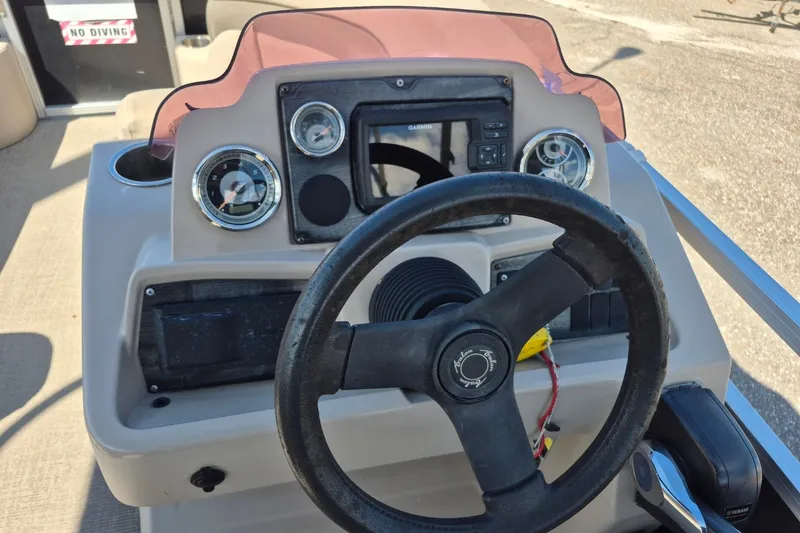 Slide: The Image of Steering console of a 2021 Avalon VLS 2080 QL boat with gauges and controls. - 12