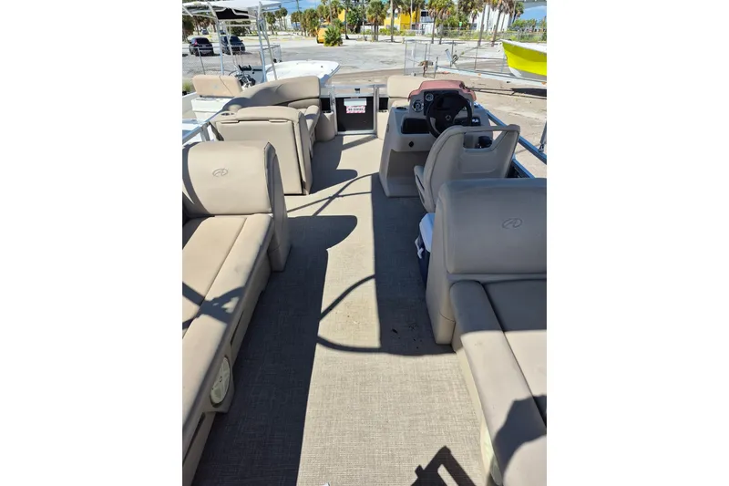 Slide: The Image of Interior view of 2021 Avalon VLS 2080 QL pontoon boat with beige seating. - 9