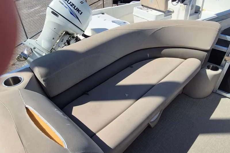 Slide: The Image of 2021 Avalon VLS 2080 QL boat interior with beige seating and Suzuki outboard motor. - 20