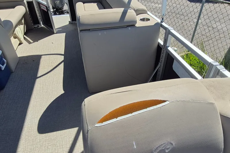 Slide: The Image of Damaged seating on 2021 Avalon VLS 2080 QL boat, showing tear and exposed foam. - 21