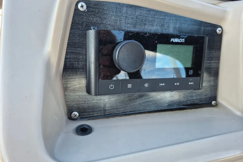Slide: The Image of Control panel of a 2021 Avalon VLS 2080 QL boat with Fusion audio system. - 13
