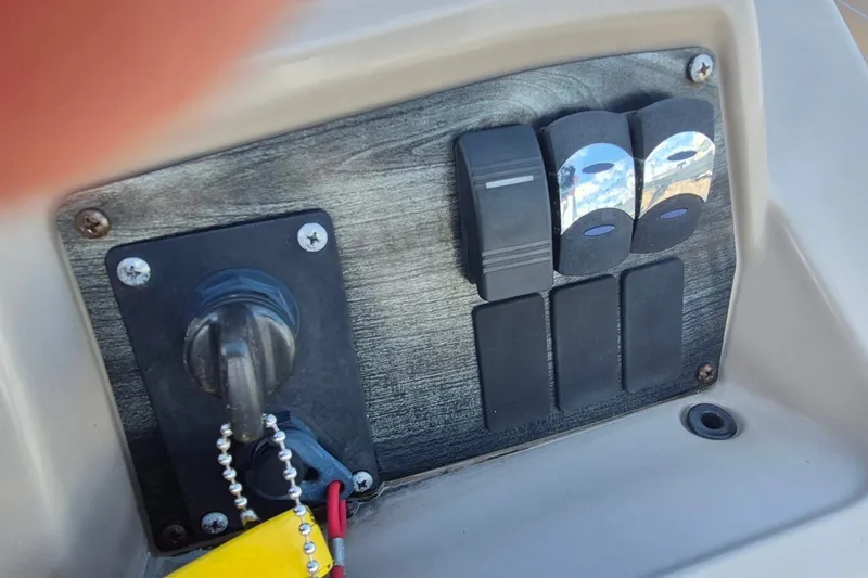 Slide: The Image of Control panel of 2021 Avalon VLS 2080 QL boat with switches and ignition key. - 17