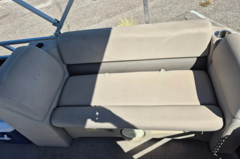 Slide: The Image of Beige seating on 2021 Avalon VLS 2080 QL boat with cup holders and armrests. - 11
