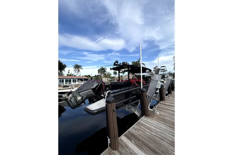Slide: The Image of 2023 BRABUS Shadow 900 ST docked, showcasing sleek design and powerful engines under a clear sky. - 13