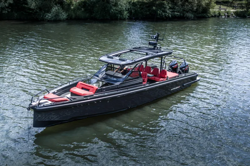 Slide: The Image of 2023 BRABUS Shadow 900 ST boat with sleek design and red seating on the water. - 14