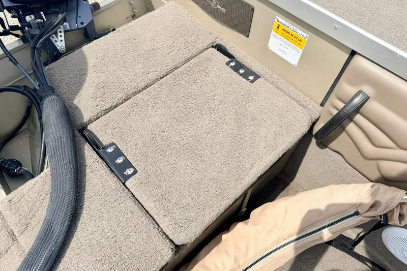 Slide: The Image of 2008 G3 Angler V185 FS boat interior with carpeted seating and capacity label. - 30