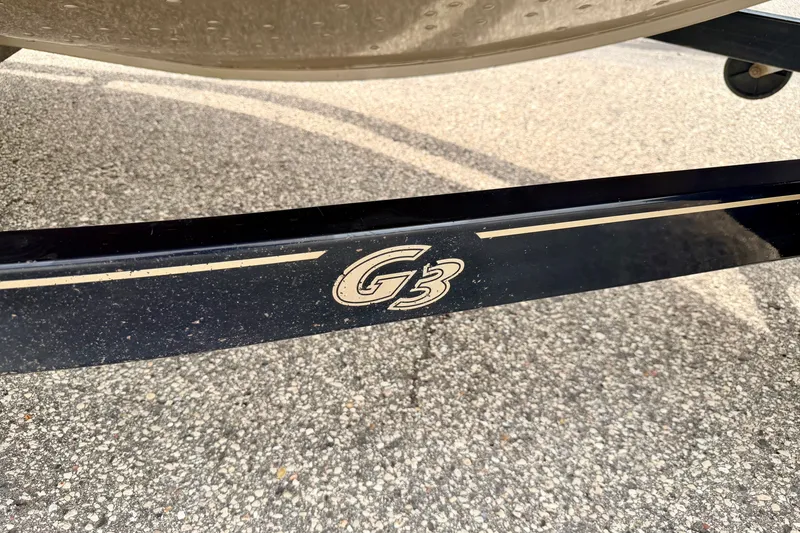 Slide: The Image of 2008 G3 Angler V185 FS boat trailer on asphalt surface. - 84