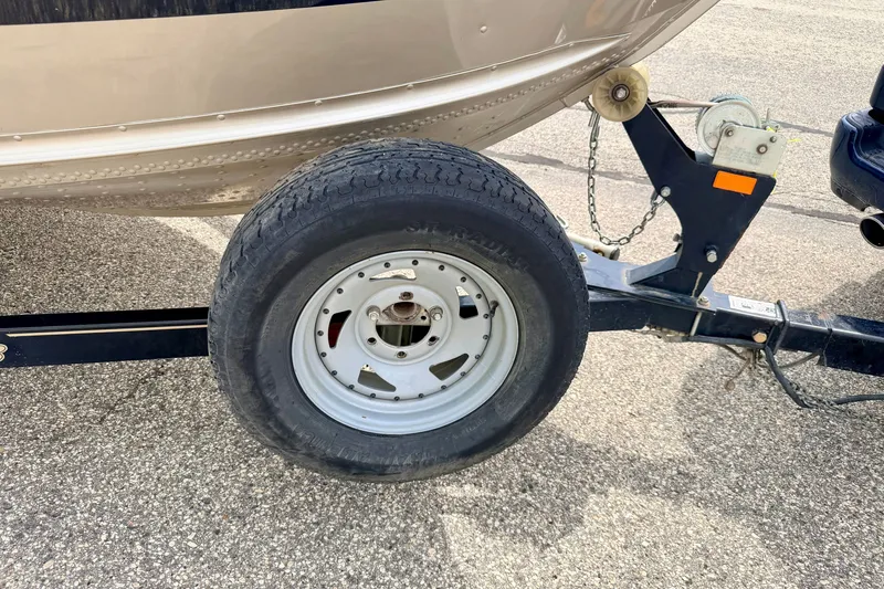 Slide: The Image of Trailer wheel of 2008 G3 Angler V185 FS boat on pavement. - 85